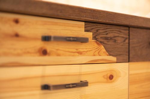 a close up of a wooden chest of drawers at PRIVILLAGE Stare - Villa & Chalet in Bohinj