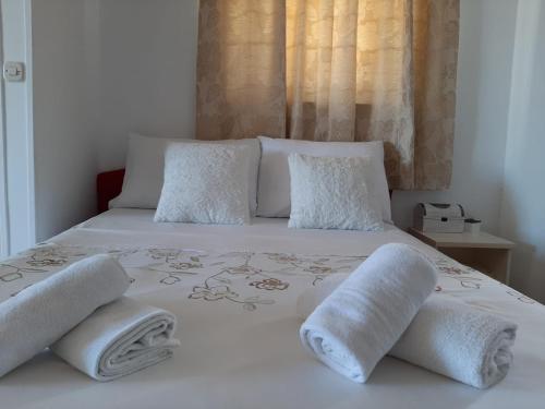 Postel nebo postele na pokoji v ubytování Apartmani Sollei