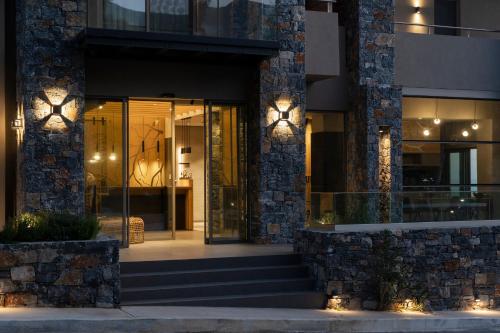 a facade of a building with lights on it at panorama new generation in Sfakia