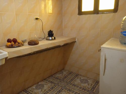 a bathroom with a plate of fruit on a shelf at sababa village in Nuweiba