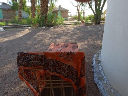 a table with a blanket on top of it at sababa village in Nuweiba