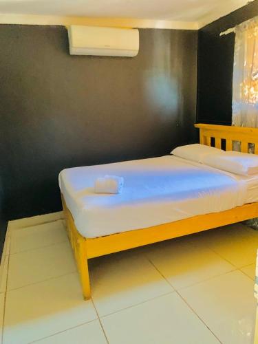 a bedroom with two beds in a room at Siyaya’s Guest Palace in Jozini