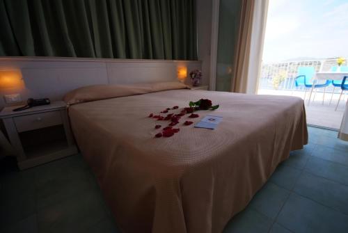 Postel nebo postele na pokoji v ubytování Hotel Dino