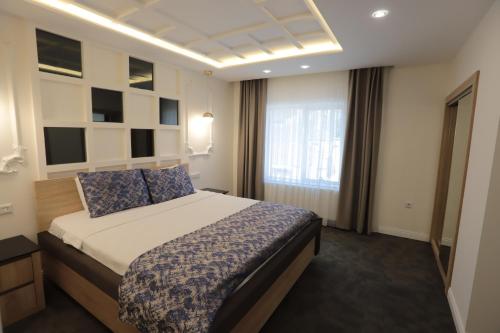 Katil atau katil-katil dalam bilik di AYDINLI HOTEL