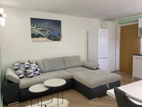 a living room with a couch and two tables at One bedroom Guesthouse Tina in Matulji