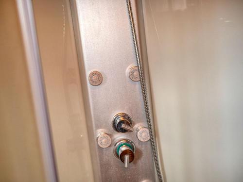 a metal door with a lock and a knob at Penzión Hron - Beňuš in Beňuš