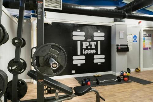 a gym with a sign on the wall at Buchanan Arms Hotel & Leisure, Sure Hotel Collection in Drymen