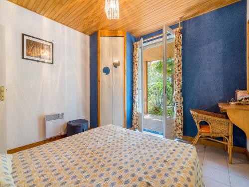 a bedroom with a bed and a window at Family Escape in Les Salelles in Chambonas