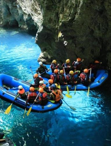 a group of people in rafts in the water at Da Pietro in Bagni di Lucca