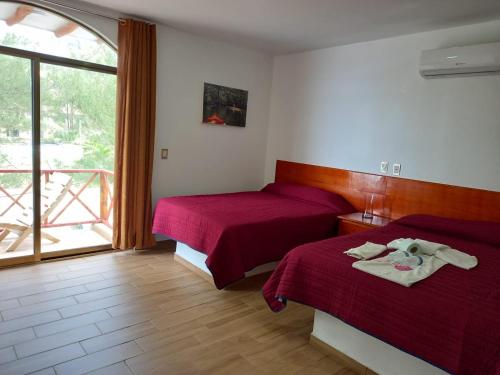 Postel nebo postele na pokoji v ubytování Hotel El Rincon de Don Juan