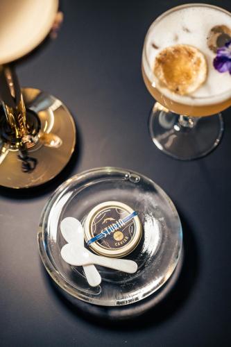 a silver plate with a dessert on a table at Villas Foch Boutique Hotel & Spa Bordeaux in Bordeaux