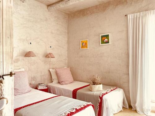 Postel nebo postele na pokoji v ubytování Casa Matelito