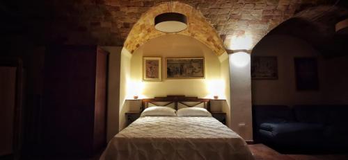Postel nebo postele na pokoji v ubytování La Cisterna del Vicinato