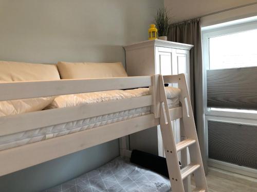 Postel nebo postele na pokoji v ubytování Loft Froenskip Nordsee Park Dangast