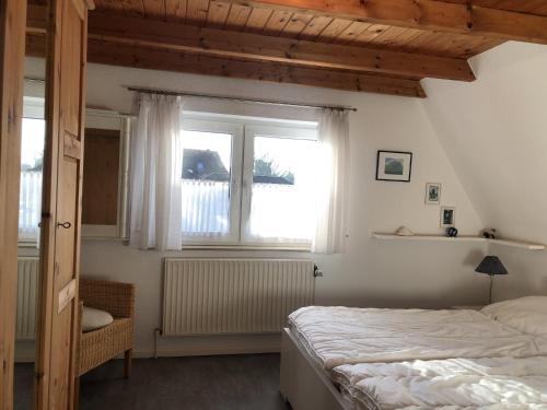 Postel nebo postele na pokoji v ubytování Blaue Oase Ferienhaus