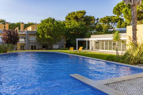 a swimming pool in the backyard of a house at Penthouse Duplex Rooftop Jacuzzi 4 Rooms 6 beds 8 Persons in Cascais