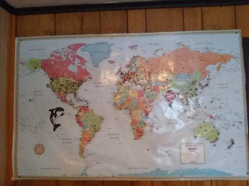 a map of the world hanging on a wall at The Orca Inn in Friday Harbor