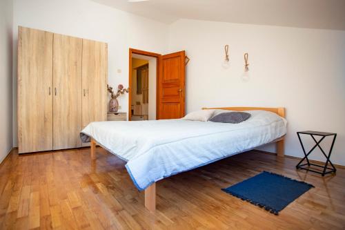 Posteľ alebo postele v izbe v ubytovaní Apartment Kika