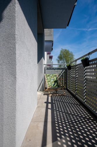 a balcony of a building with a metal railing at Apartament Willa Lniana in Sulechów