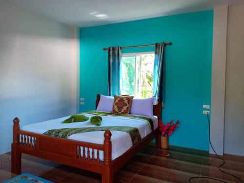 Ένα ή περισσότερα κρεβάτια σε δωμάτιο στο Baan Haneen At Lanta