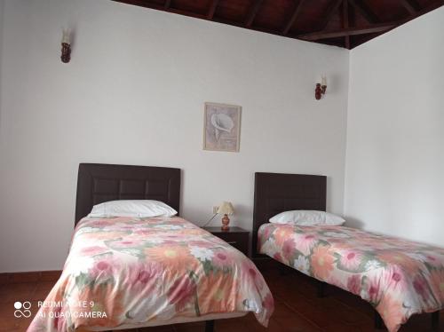 Postel nebo postele na pokoji v ubytování Casa PESTANA