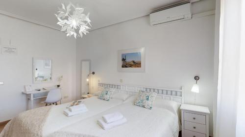 Postel nebo postele na pokoji v ubytování Hotel Consuegra