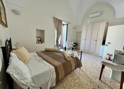 a bedroom with a bed in a room with a window at camera matrimoniale centro storico Galatina in Galatina