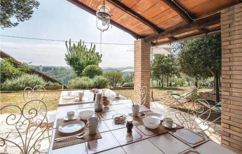 a table with dishes on it on a patio at Il Seminario in Collevecchio