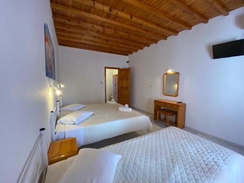 Ένα ή περισσότερα κρεβάτια σε δωμάτιο στο Anemos Apartments