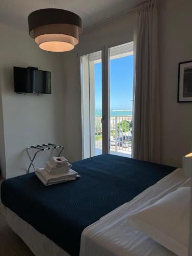 Posteľ alebo postele v izbe v ubytovaní Hotel Riva e Mare