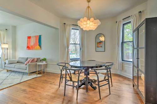 a living room with a table and a couch at Spacious Oak Park Home, 11 Mi to Downtown Chicago! in Oak Park