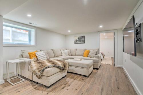 a living room with a couch and a table at Spacious Oak Park Home, 11 Mi to Downtown Chicago! in Oak Park