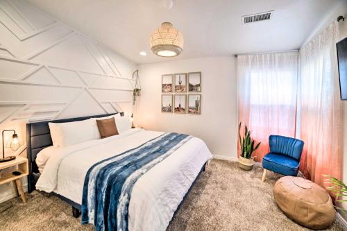a bedroom with a bed and a blue chair at Sunny Page Home The Gateway to AZ Adventure! in Page