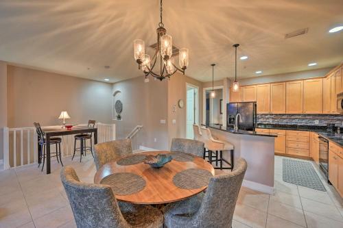 a dining room and kitchen with a table and chairs at Naples Resort Townhome with Endless Amenities! in Lely Resort