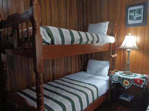 Postel nebo postele na pokoji v ubytování Hotel Bell Bird