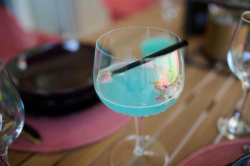 a wine glass with a fish in it on a table at Apartments Dolcea in Umag