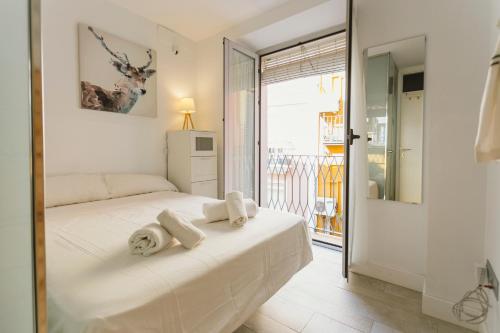 A bed or beds in a room at Empecinado