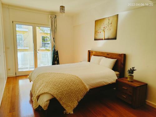 Postel nebo postele na pokoji v ubytování Luxury Home in Lisboa Expo