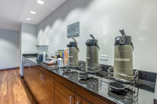a kitchen with two kettles on a counter at Comfort Inn St Louis Airport in Bridgeton