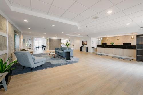 an office lobby with chairs and a reception desk at Hotel Bethany Beach in Bethany Beach