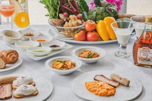 a table topped with plates of food and drinks at Harmonie Embrassee in Osaka