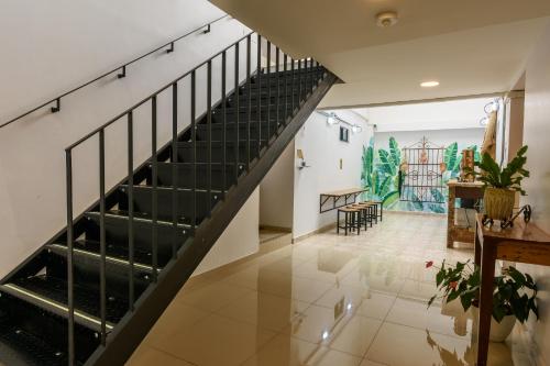 
a large staircase leading up to a large room at Med la palma in Medellín
