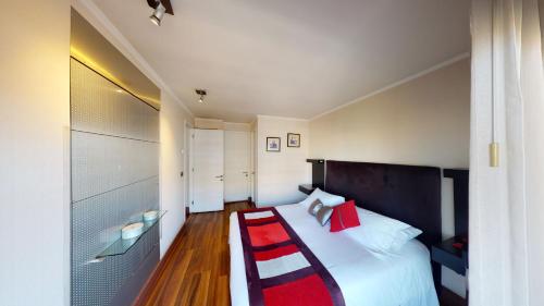Una cama o camas en una habitación de My Aparts SCL