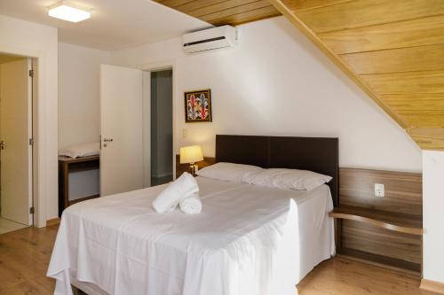 Ένα ή περισσότερα κρεβάτια σε δωμάτιο στο Apartamento em otima localizacao em Gramado