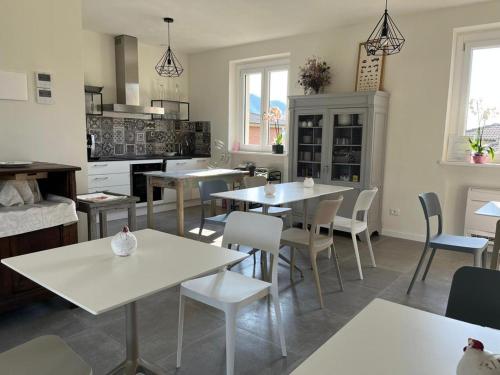 a kitchen with tables and chairs in a room at I Cappuccini wellness in Varzi