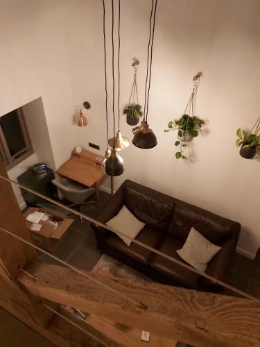 a living room with a couch and a table at Sweet Meadow Lodge in Exeter