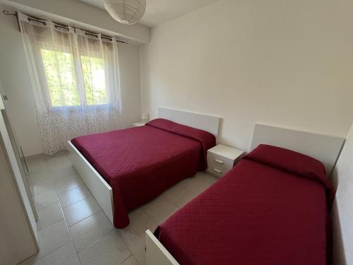 Letto o letti in una camera di Casa Vacanze Tortora