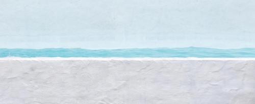 a white wall with the ocean in the background at Épicos House, Your home away from home. in Nogueira