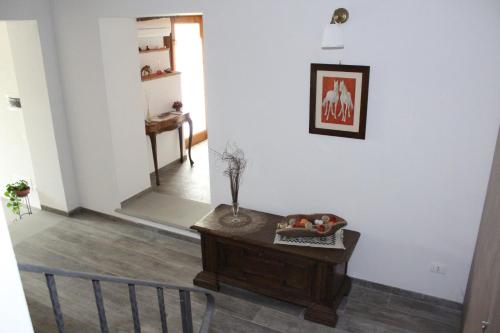 a living room with a table and a chair at Art Apartment Chianti Family in Lappeggi