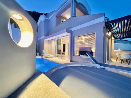 a villa with a swimming pool and a house at Luxury Villa Barbati Sun with private pool by DadoVillas in Barbati